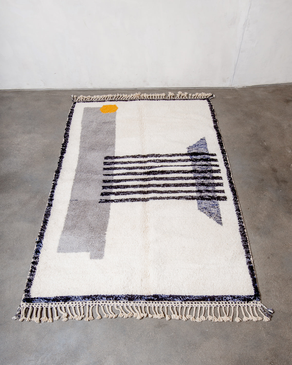 Modern, designer, handcrafted Berber rug from Morocco. Beniourain carpet with beautiful colours and patterns and fluffy wool texture.